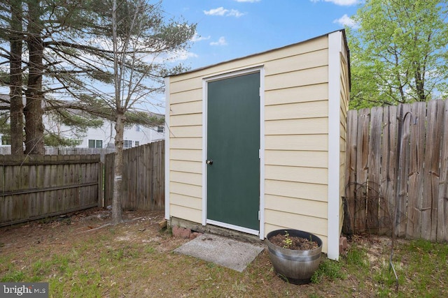 view of shed featuring a fenced backyard