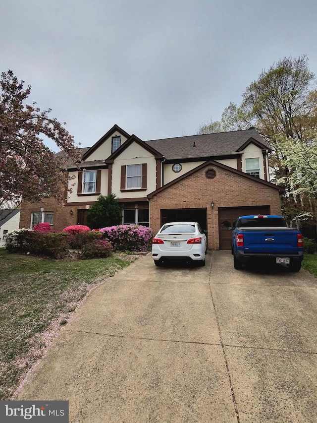 5408 Kennington Pl, Fairfax, VA 22032 - view of front of home with concrete driveway, an attached garage, and brick siding