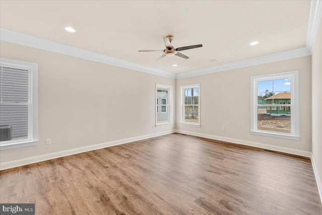 12524 Salisbury Rd, Ocean City, MD 21842 - spare room with ornamental molding, a healthy amount of sunlight, and wood finished floors