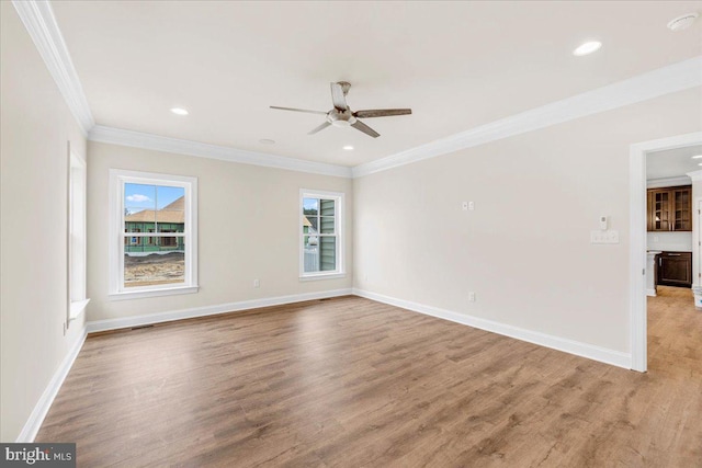 12524 Salisbury Rd, Ocean City, MD 21842 - spare room featuring light wood-type flooring, baseboards, ceiling fan, and crown molding