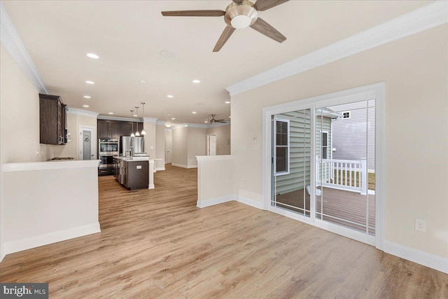 12524 Salisbury Rd, Ocean City, MD 21842 - unfurnished living room with recessed lighting, crown molding, baseboards, and ceiling fan