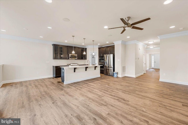 12524 Salisbury Rd, Ocean City, MD 21842 - kitchen featuring recessed lighting, crown molding, appliances with stainless steel finishes, and open floor plan