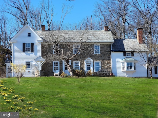 3837 Curly Hill Rd, Doylestown, PA 18902 - colonial inspired home featuring a chimney, a front lawn, and stone siding