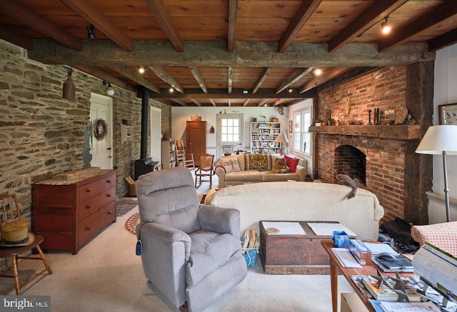 3837 Curly Hill Rd, Doylestown, PA 18902 - living room with wooden ceiling, light carpet, a brick fireplace, beam ceiling, and a wood stove