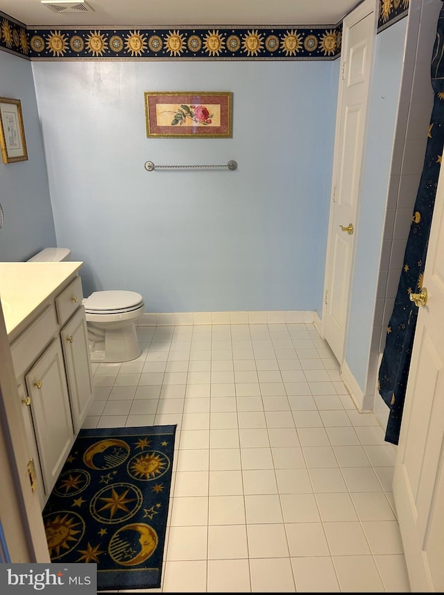 bathroom with vanity, tile patterned floors, visible vents, and toilet