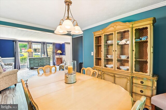 dining area featuring ornamental molding
