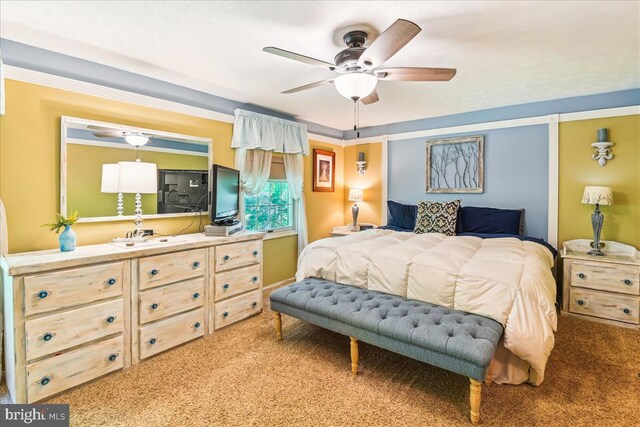 carpeted bedroom featuring ceiling fan