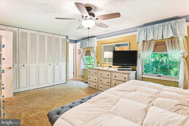 carpeted bedroom featuring ceiling fan