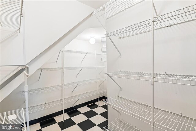walk in closet with tile patterned floors