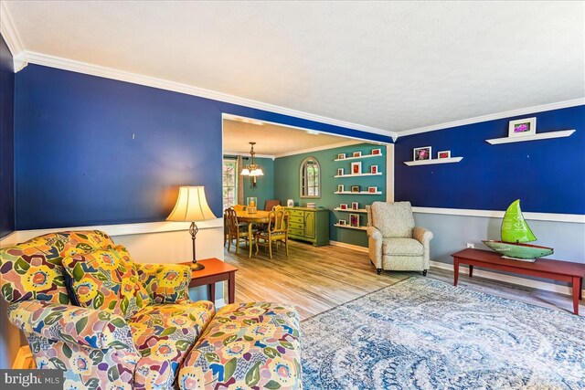 living room featuring crown molding and wood finished floors
