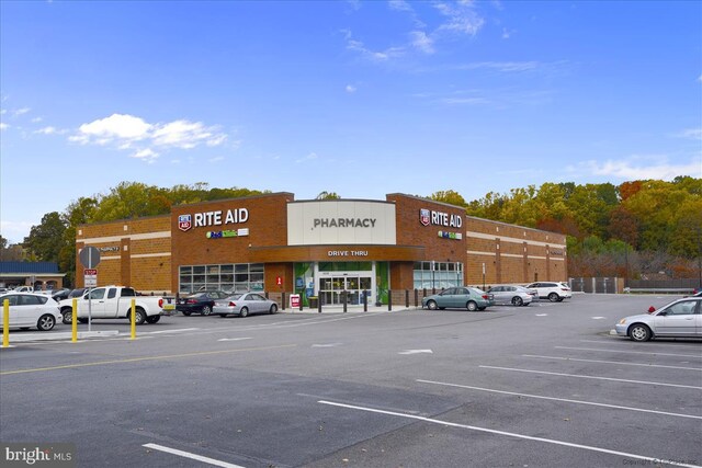 view of property with uncovered parking