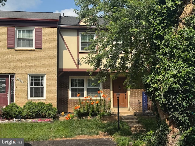 14855 Leicester Ct, Centreville, VA 20120 - view of front of property with brick siding, stucco siding, and roof with shingles