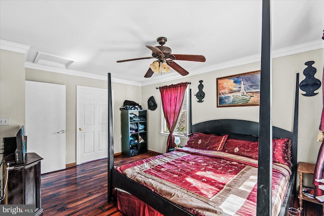 bedroom featuring a ceiling fan, attic access, crown molding, and wood finished floors