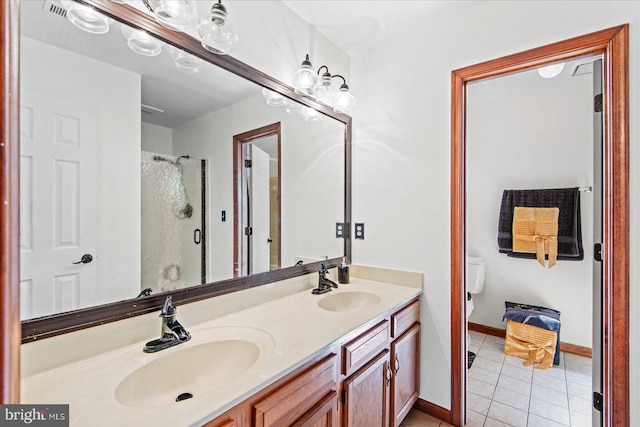 bathroom with a shower with shower door, tile patterned floors, double vanity, and a sink