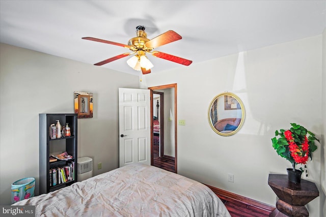 bedroom with wood finished floors and ceiling fan