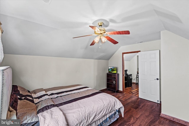 bedroom featuring lofted ceiling, ceiling fan, baseboards, and wood finished floors