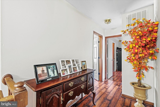 hall with wood finished floors