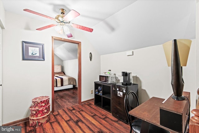 office space featuring wood finished floors, baseboards, a ceiling fan, and lofted ceiling