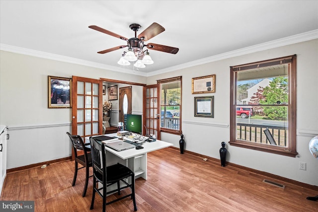 office space featuring french doors, wood finished floors, visible vents, and a wealth of natural light