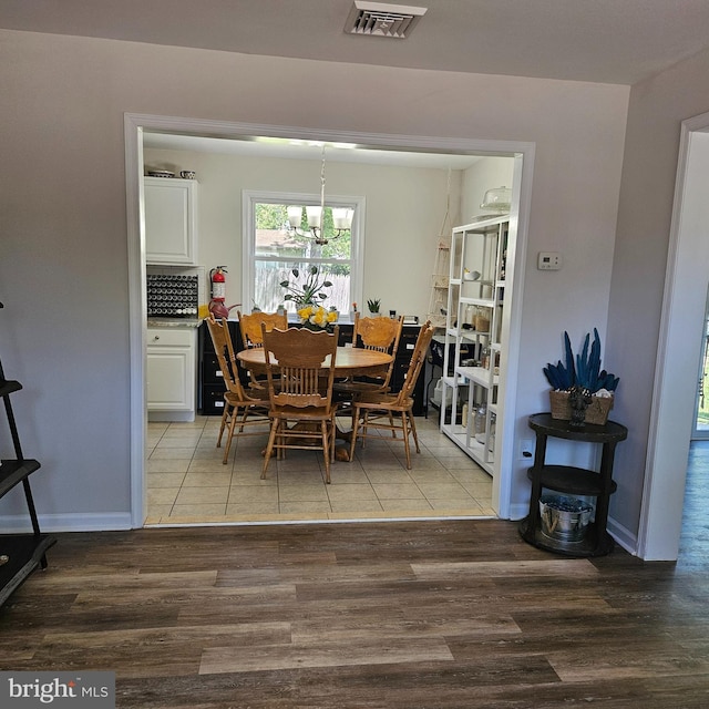 110 Harwich St, Browns Mills, NJ 08015 - dining area with light wood finished floors and a chandelier