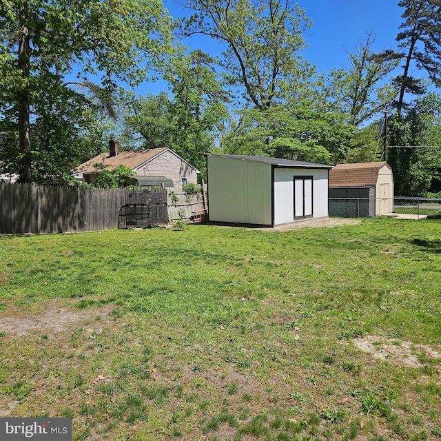 110 Harwich St, Browns Mills, NJ 08015 - view of yard with a storage shed and an outbuilding