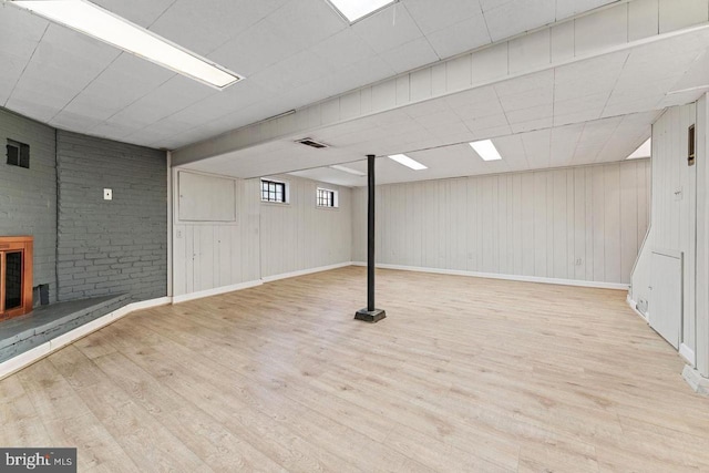 below grade area featuring visible vents and wood finished floors
