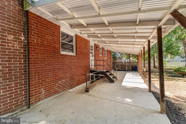 view of patio featuring fence