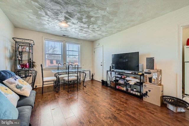dining space featuring visible vents and wood finished floors