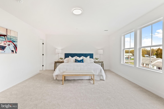 bedroom featuring carpet, visible vents, and baseboards