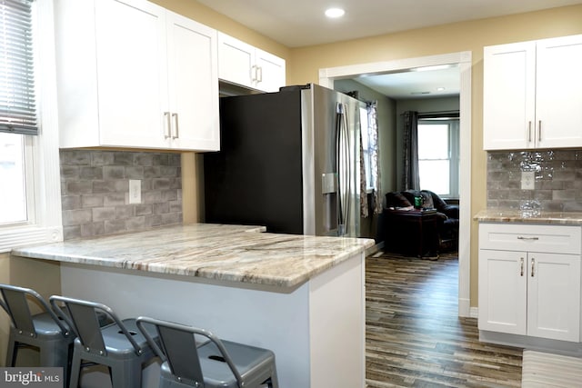360 Haverford Ave, Wenonah, NJ 08090 - kitchen with stainless steel refrigerator with ice dispenser, dark wood-style flooring, light stone counters, and white cabinetry