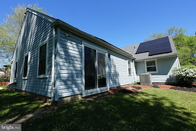 360 Haverford Ave, Wenonah, NJ 08090 - back of house featuring a yard, cooling unit, and roof mounted solar panels