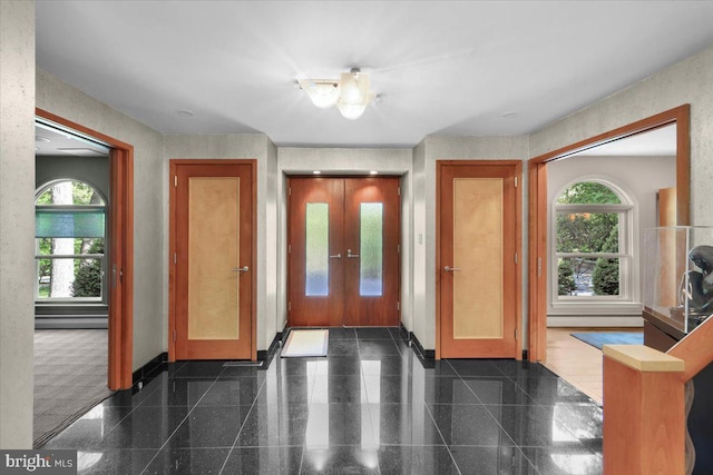400 Highview Dr, Wayne, PA 19087 - foyer featuring granite floors, plenty of natural light, and baseboards