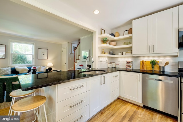 kitchen with crown molding, open shelves, a sink, tasteful backsplash, and stainless steel dishwasher