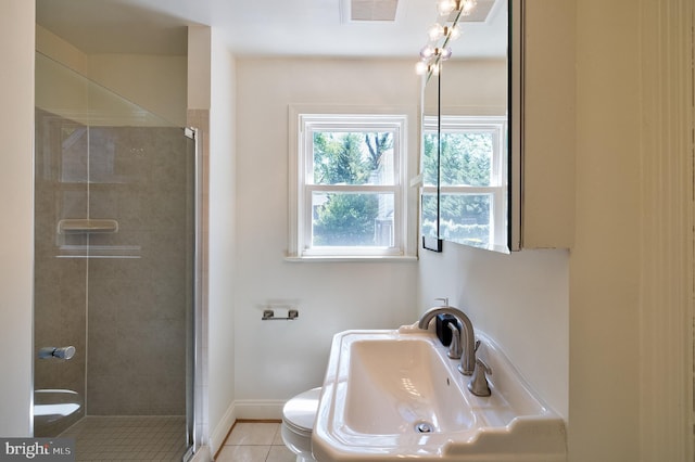 full bath featuring a sink, tile patterned flooring, toilet, visible vents, and a stall shower