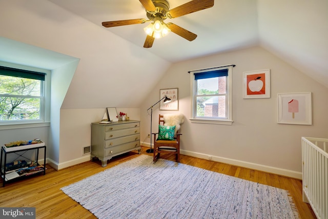 bonus room featuring wood finished floors, lofted ceiling, and a wealth of natural light