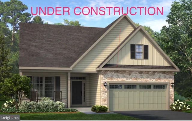 612 Greenbriar Path, Cochranville, PA 19330 - view of front of home featuring board and batten siding, stone siding, a garage, and a shingled roof