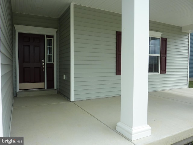 doorway to property with covered porch
