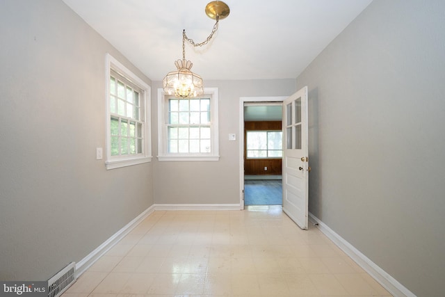 7411 Elizabeth Rd, Elkins Park, PA 19027 - unfurnished dining area featuring a chandelier, baseboards, and light flooring