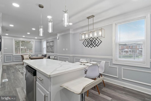 300 Denison St, Baltimore, MD 21229 - kitchen featuring dark wood-type flooring, a center island, decorative light fixtures, and dishwasher