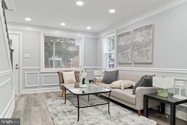 300 Denison St, Baltimore, MD 21229 - living area with a decorative wall, crown molding, recessed lighting, wood finished floors, and a wainscoted wall