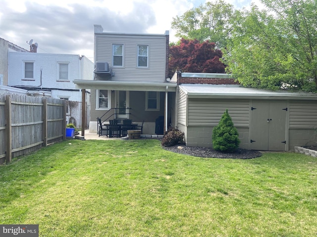 rear view of property with a patio area and central AC unit