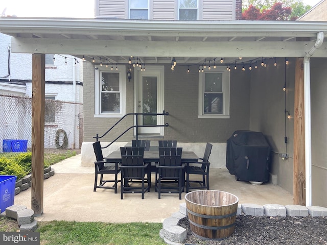 view of patio / terrace with fence, area for grilling, and outdoor dining area