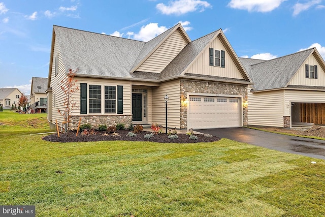 610 Greenbriar Path, Cochranville, PA 19330 - view of front of house with stone siding, driveway, a shingled roof, and a front lawn