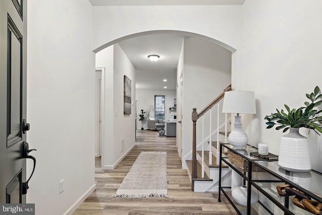 610 Greenbriar Path, Cochranville, PA 19330 - entryway featuring arched walkways, light wood-style floors, and stairs