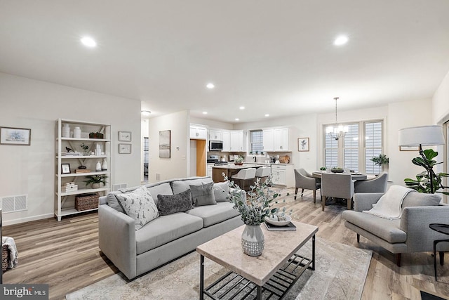 610 Greenbriar Path, Cochranville, PA 19330 - living room featuring light wood-style flooring, recessed lighting, and a chandelier