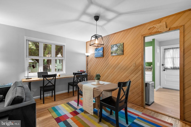 9830 Hollow Glen Pl Unit 2562, Silver Spring, MD 20910 - dining space with healthy amount of natural light, a desk, light wood finished floors, wood walls, and baseboards
