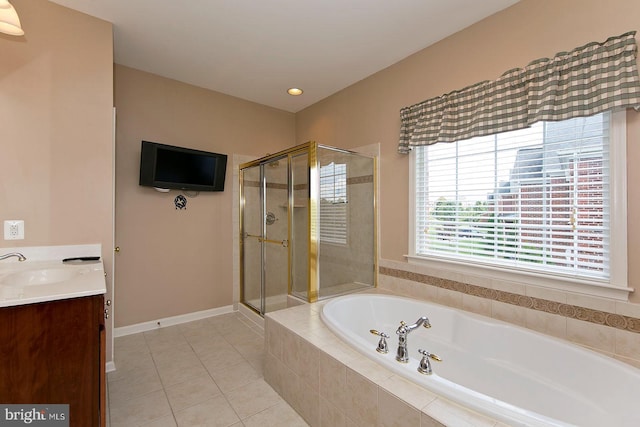 full bathroom featuring vanity, baseboards, tile patterned flooring, a shower stall, and a bath