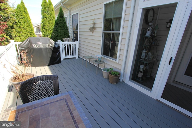 wooden deck featuring grilling area