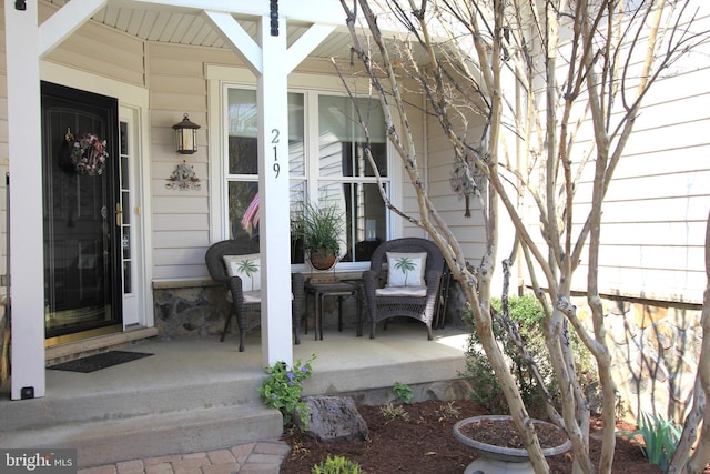 doorway to property featuring a porch