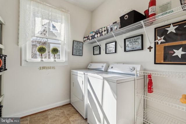 laundry area featuring laundry area, baseboards, and washing machine and dryer
